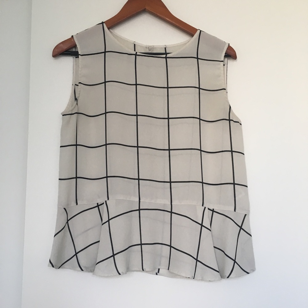 Black and white grid peplum sleeveless top